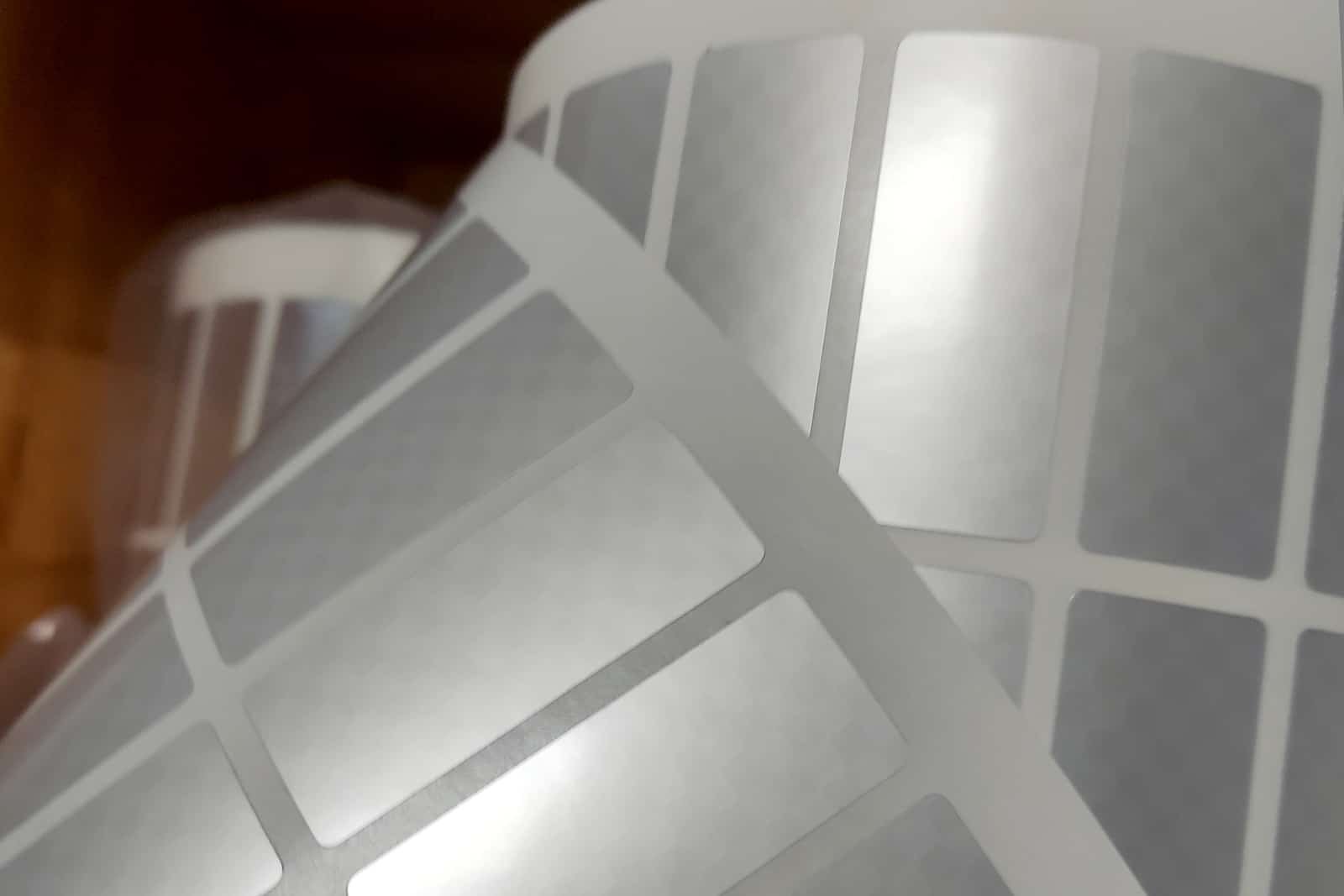 Security labels for warranty, tamper evident materials